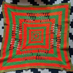 Vintage 35” x 40” orange and green Afghan wall hanging